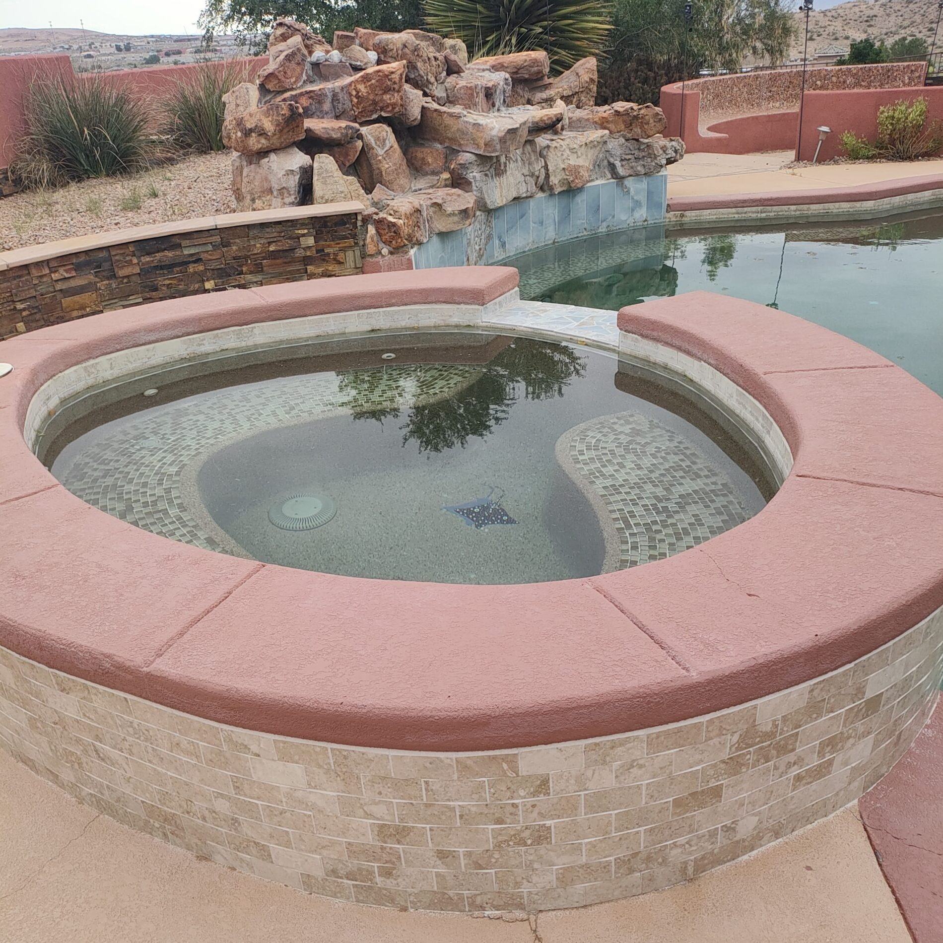 Clean spa attached to a swimming pool